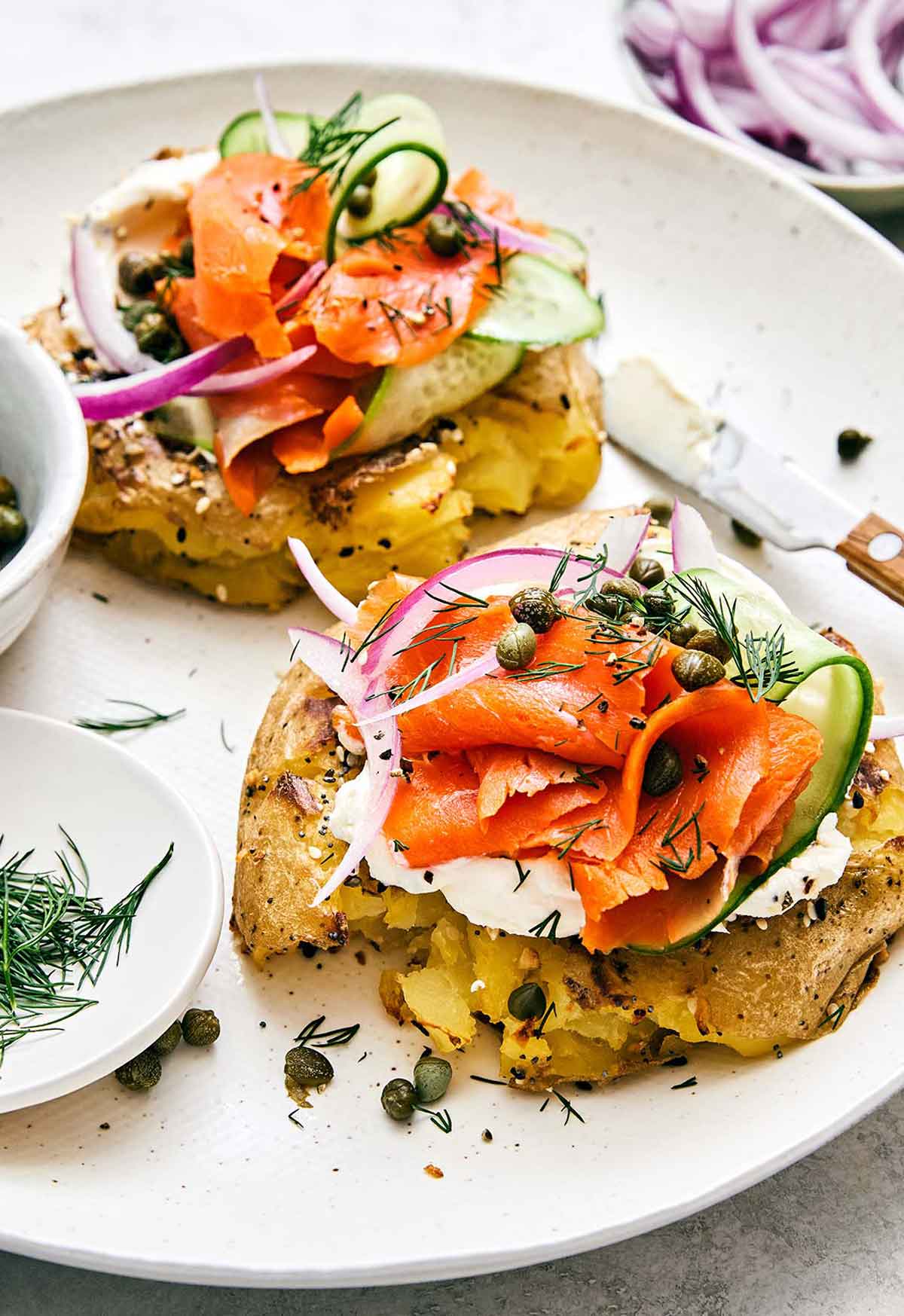 Healthy breakfast idea featuring a smoked salmon smashed potato bagel.