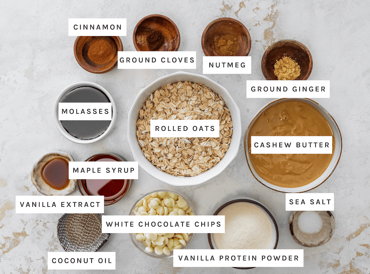Cinnamon, Ground cloves, Nutmeg, Ground ginger, Molasses, Rolled oats, Cashew butter, Sea salt, Maple syrup, Vanilla extract, White chocolate chips, Vanilla protein powder, Coconut oil