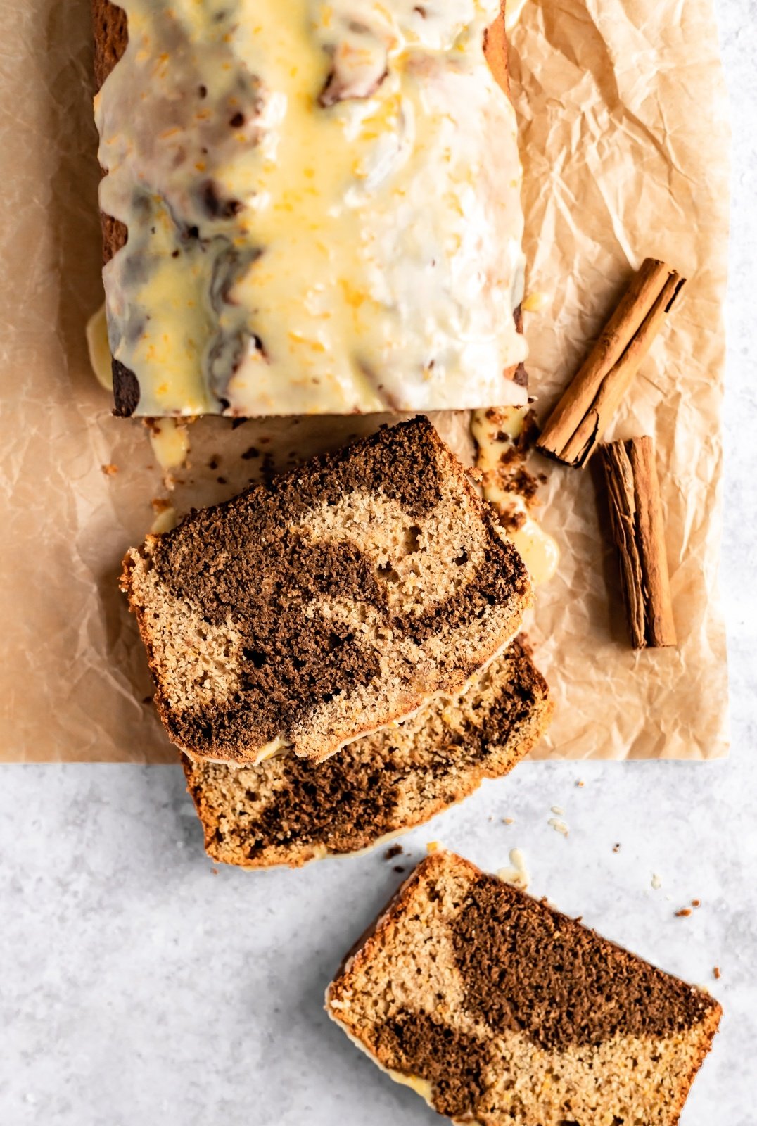 orange gingerbread swirl loaf sliced on parchment paper