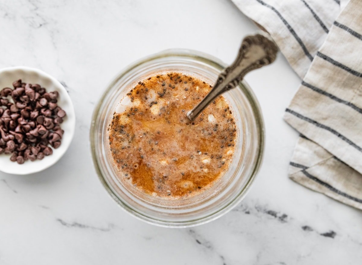 Overhead view of cookie dough overnight oats topped with cinnamon and mini chocolate chips.