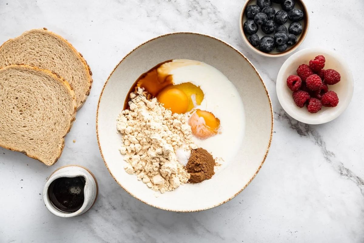 Protein French toast batter ingredients in bowl before mixing.