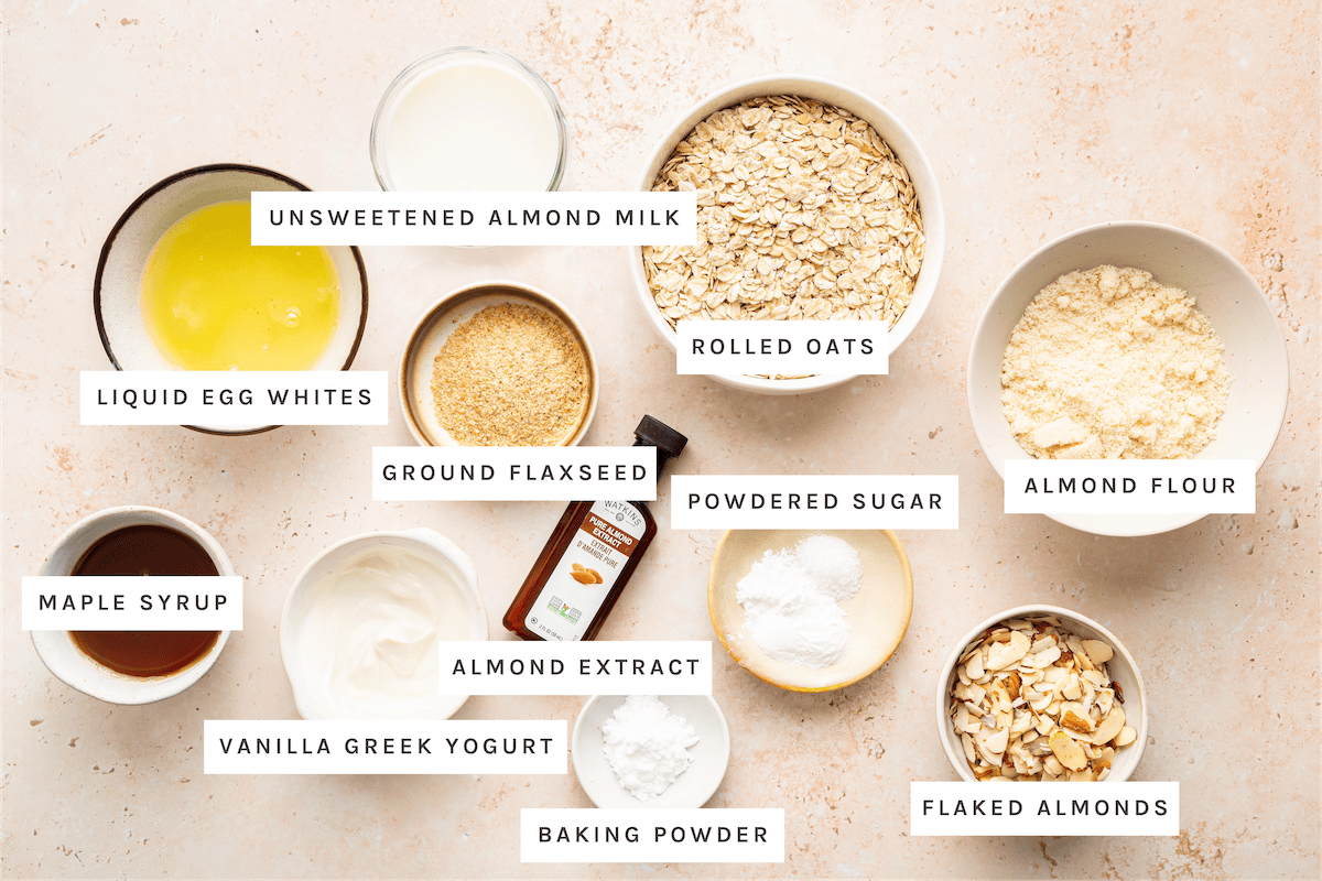 Unsweetened almond milk, liquid egg whites, ground flaxseed, rolled oats, almond flour, maple syrup, vanilla Greek yogurt, almond extract, powdered sugar, baking powder, flaked almonds