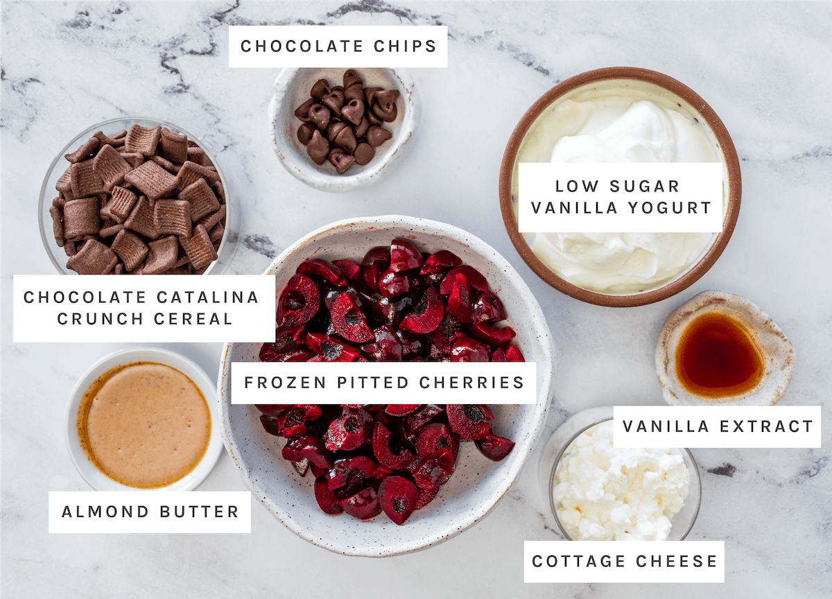Chocolate chips, low sugar vanilla yogurt, chocolate Catalina Crunch cereal, frozen pitted cherries, vanilla extract, almond butter, cottage cheese