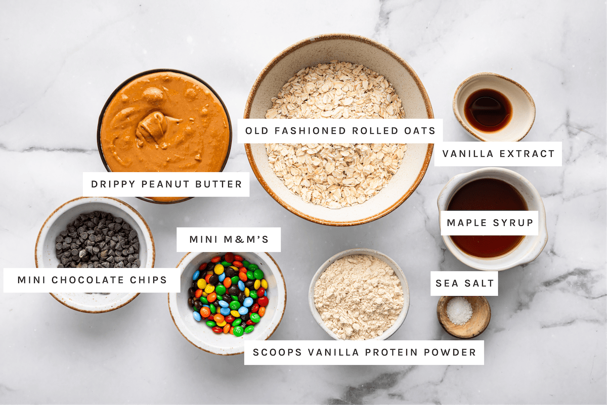 Drippy peanut butter, old fashioned rolled oats, vanilla extract, maple syrup, mini chocolate chips, mini M&M’s, vanilla protein powder, sea salt