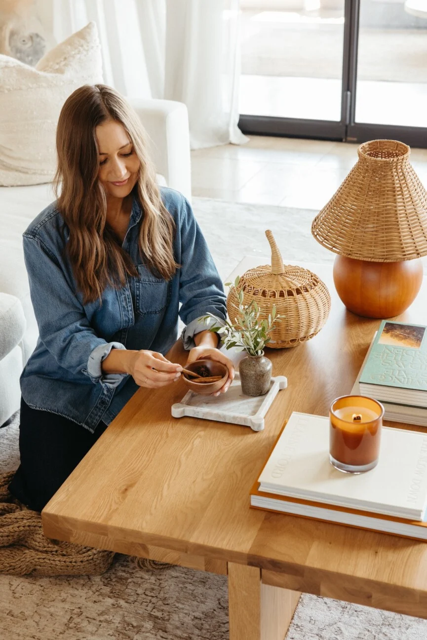 Woman lighting candle_nervous system regulation
