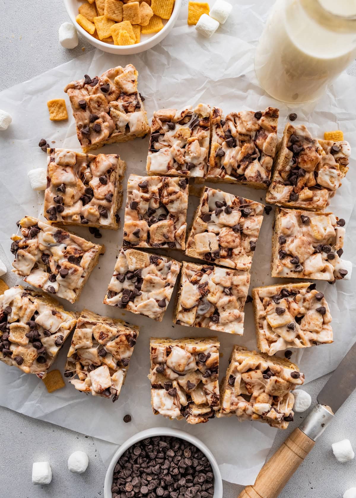 High protein s'mores treats near one another on parchment paper.
