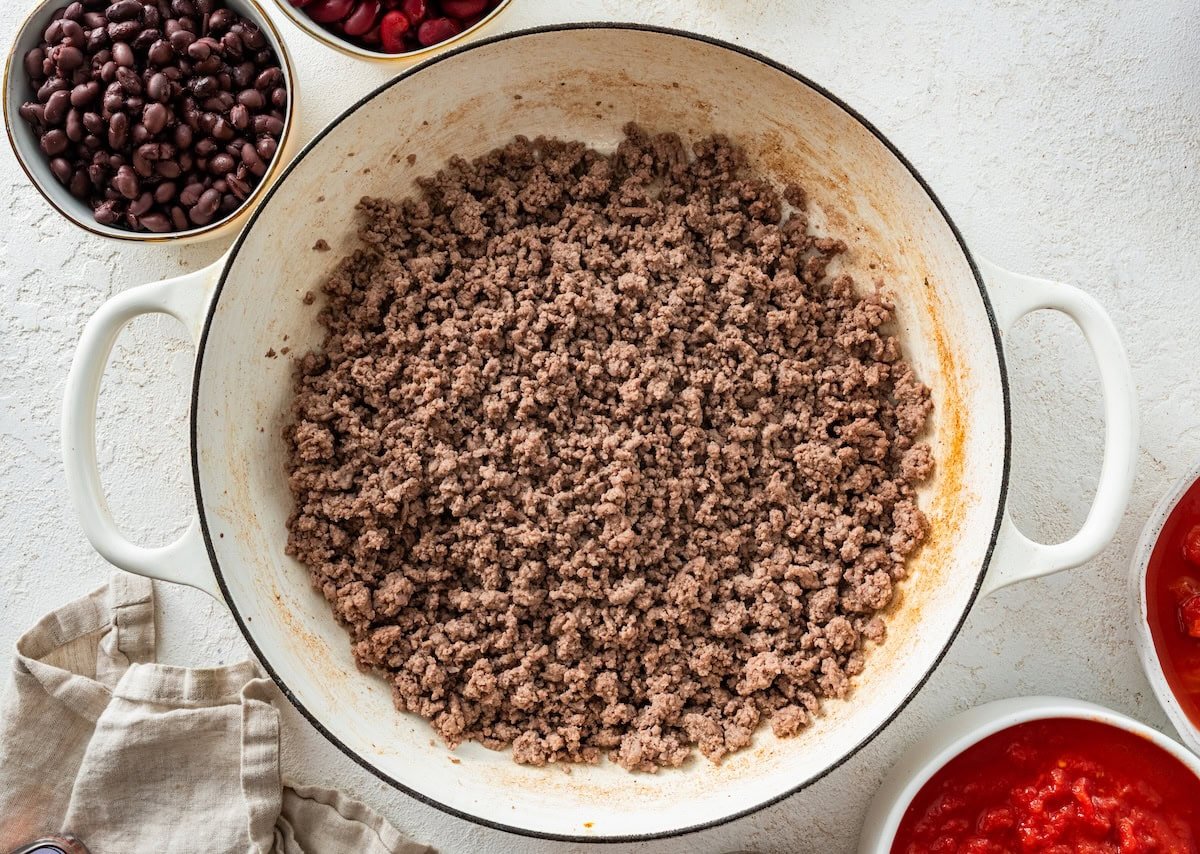 Cooked ground beef in a large pot.