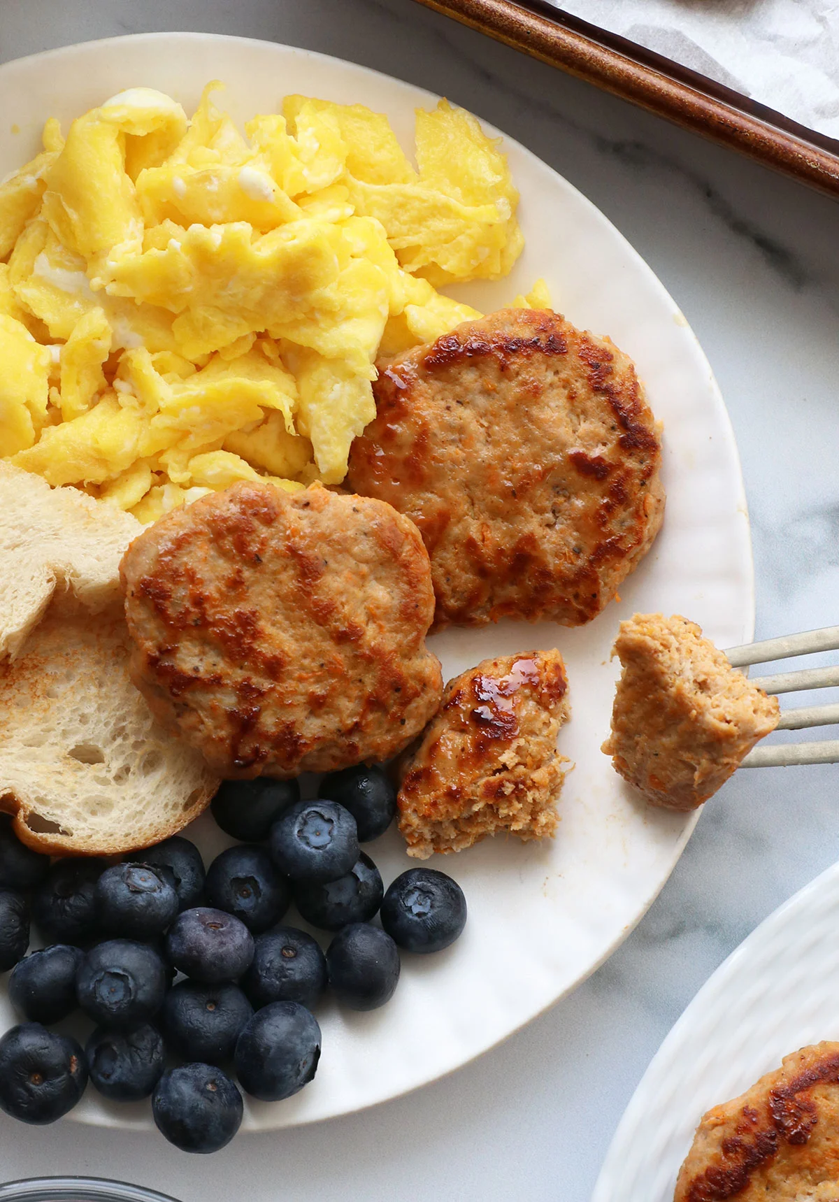 turkey sausage cut into smaller pieces with a fork. 