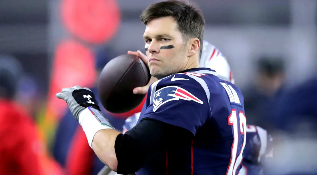 NFL Quarterback for the New England Patriots Tom Brady throwing a football