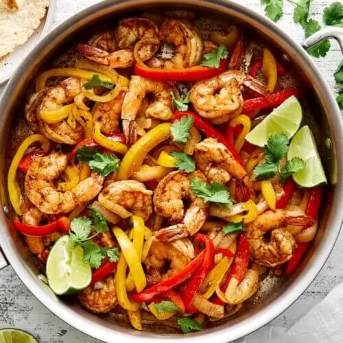A skillet of a shrimp fajitas recipe.