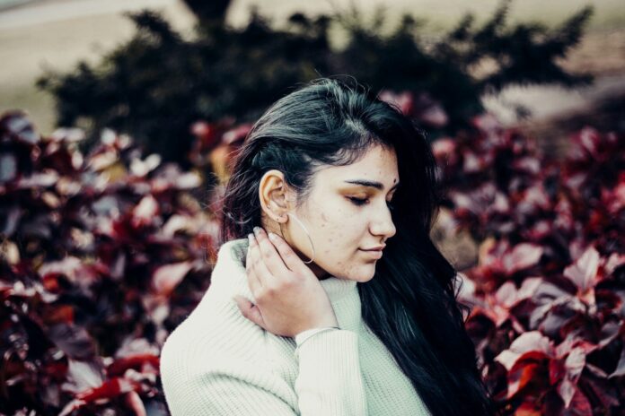 portrait photograph of woman in white sweater